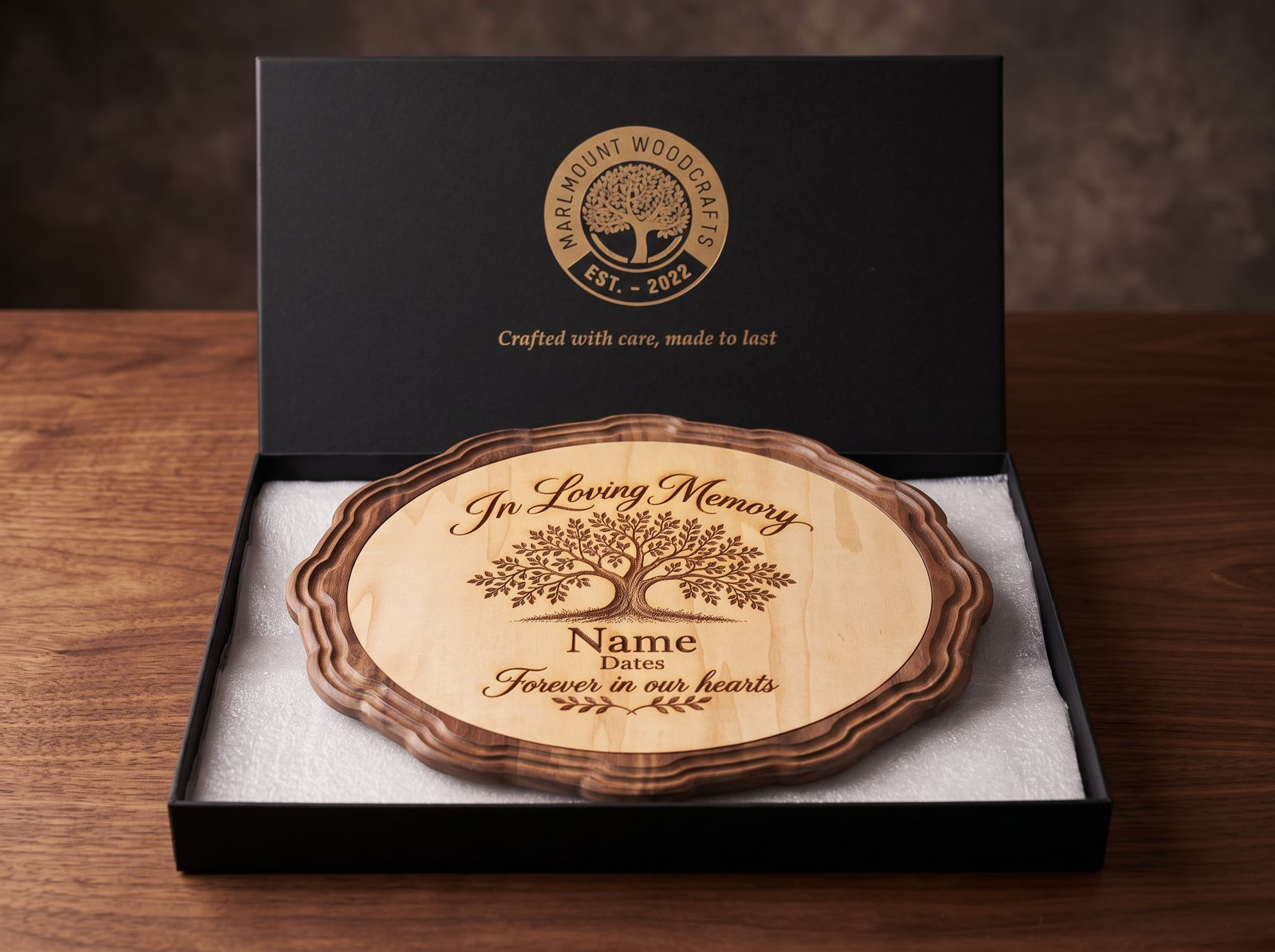 In Loving Memory plaque with engraved tree of life in a walnut frame, sitting in an open Marlmount presentation box